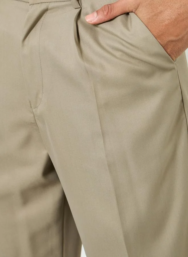 ستايلي بنطلون رجالي بيج بكسرات وقصة بوت كات